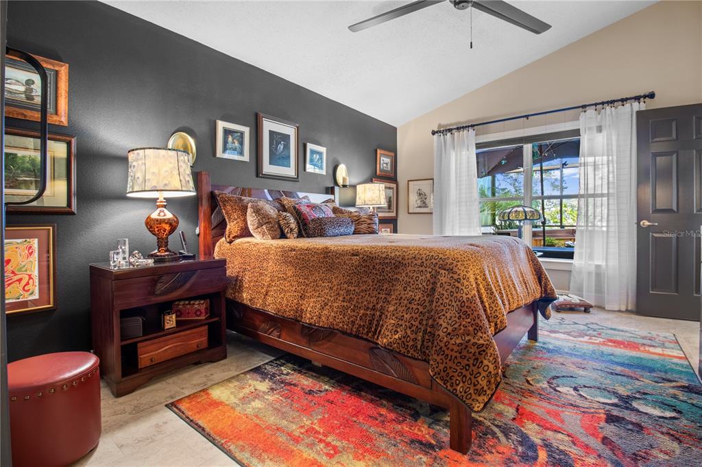 70 Center Oak Circle Spring Hill, FL 34609 - Photo 28 of 58 a bedroom with a bed and wooden floor