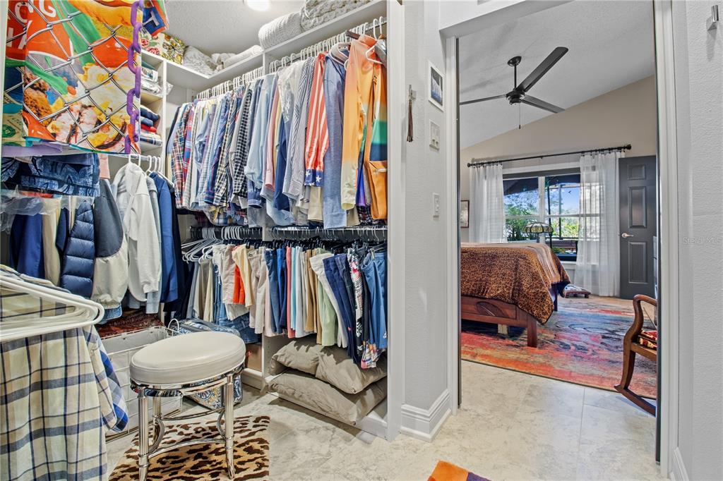 70 Center Oak Circle Spring Hill, FL 34609 - Photo 30 of 58 a view of walk in closet with clothes and shoes