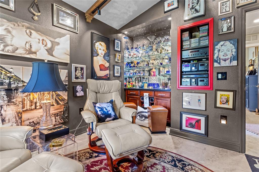 70 Center Oak Circle Spring Hill, FL 34609 - Photo 35 of 58 a living room with lots of furniture and a chandelier