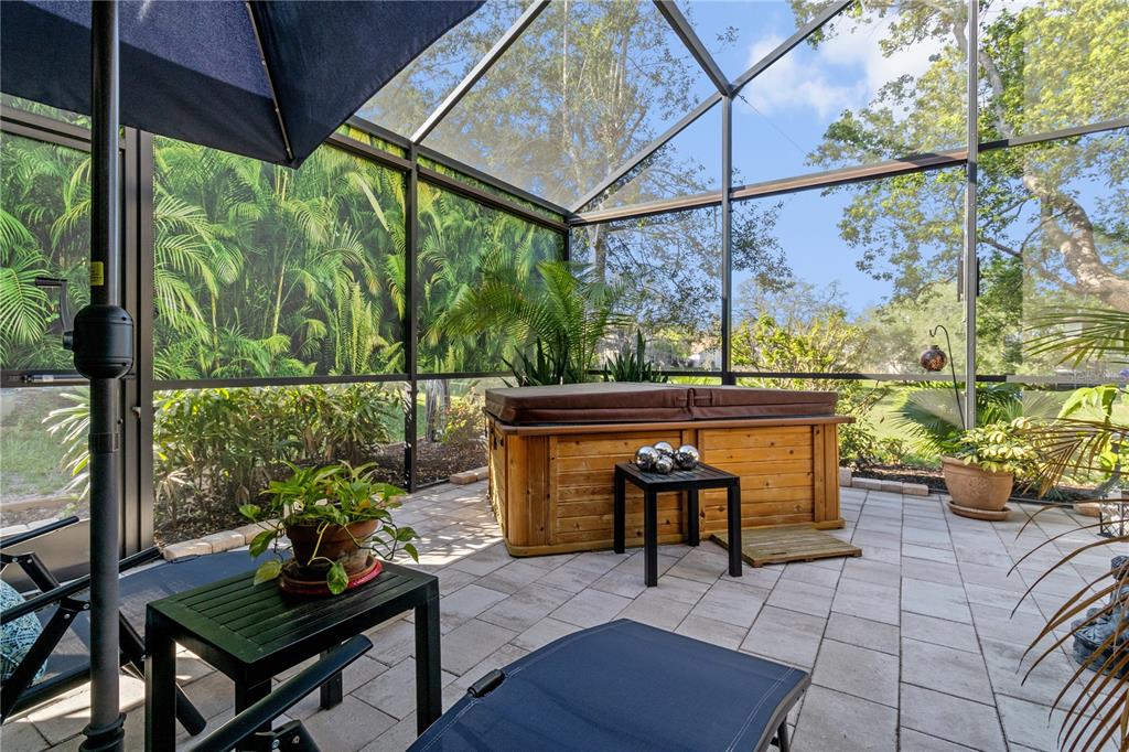 70 Center Oak Circle Spring Hill, FL 34609 - Photo 41 of 58 a view of chairs and a table in the patio