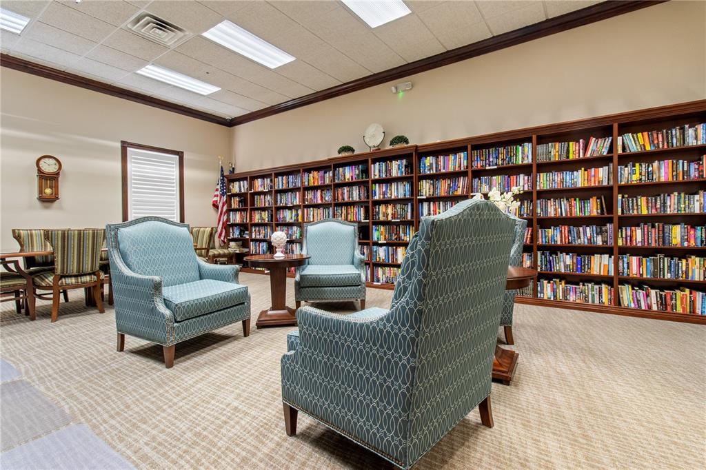 70 Center Oak Circle Spring Hill, FL 34609 - Photo 50 of 58 a living room with furniture and a book shelf