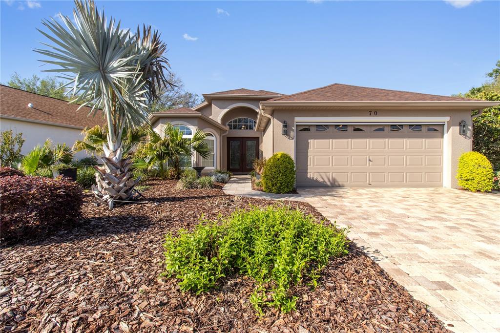 70 Center Oak Circle Spring Hill, FL 34609 - Photo 5 of 58 a front view of a house with a yard and garage