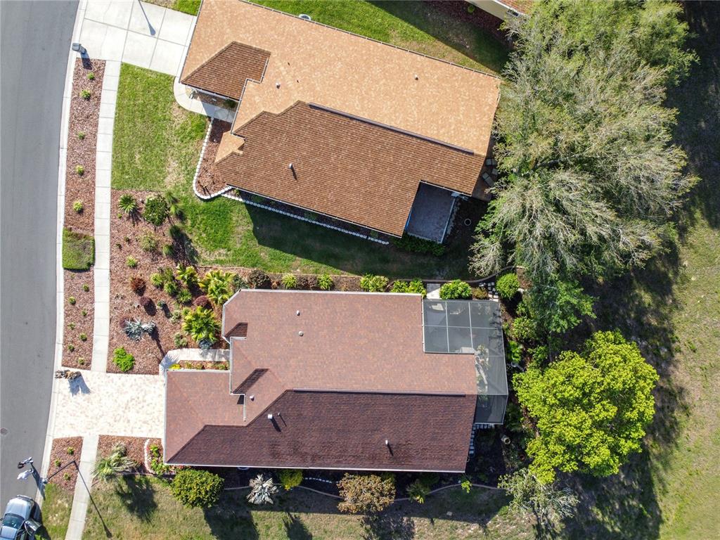 70 Center Oak Circle Spring Hill, FL 34609 - Photo 10 of 58 an aerial view of a house with yard and trees all around