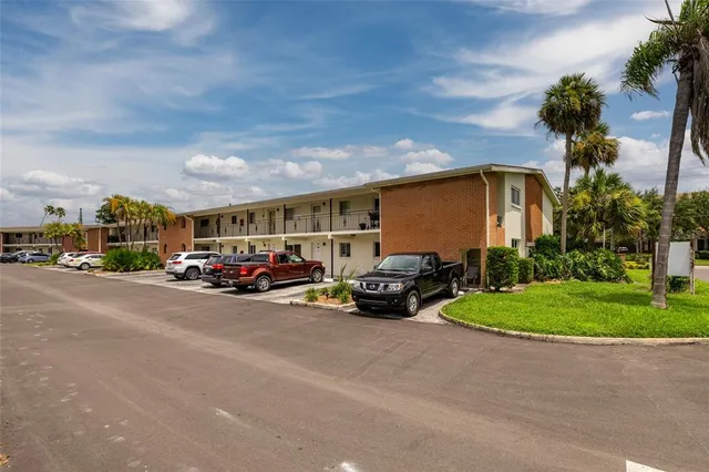 a front view of houses with yard