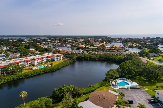 a front view of a house with swimming pool having outdoor seating
