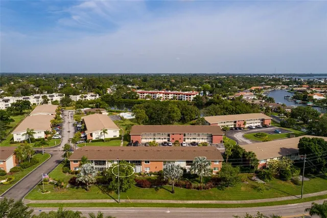 an aerial view of a city and lake view