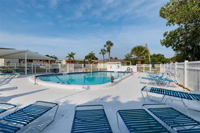 an aerial view of a house with outdoor space and lake view