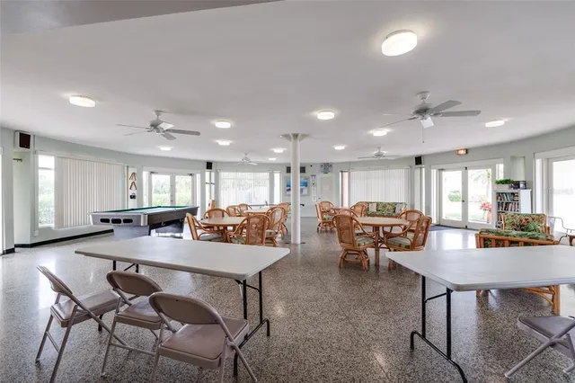 a kitchen with a refrigerator a sink and cabinets