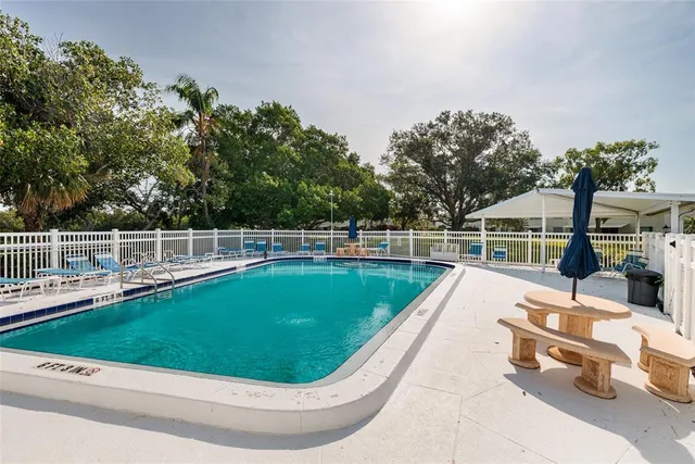a view of a swimming pool with a lounge chair
