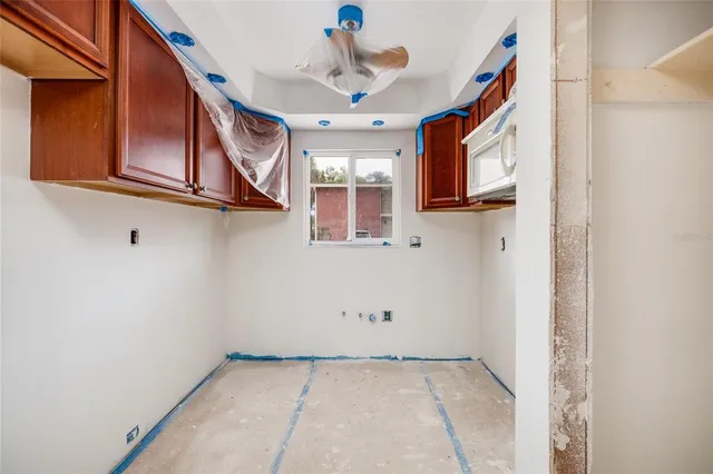 a view of a livingroom with an entryway and a window