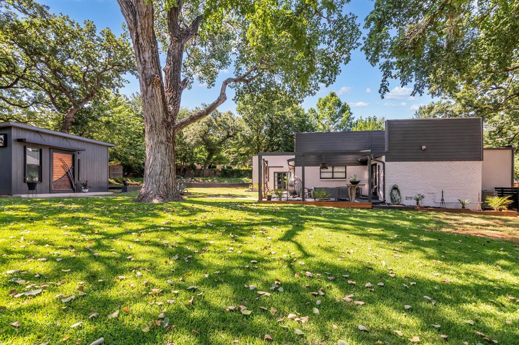 3449 West T Parr Road Grapevine, TX 76051 - Photo 29 of 32 a view of a house with a backyard