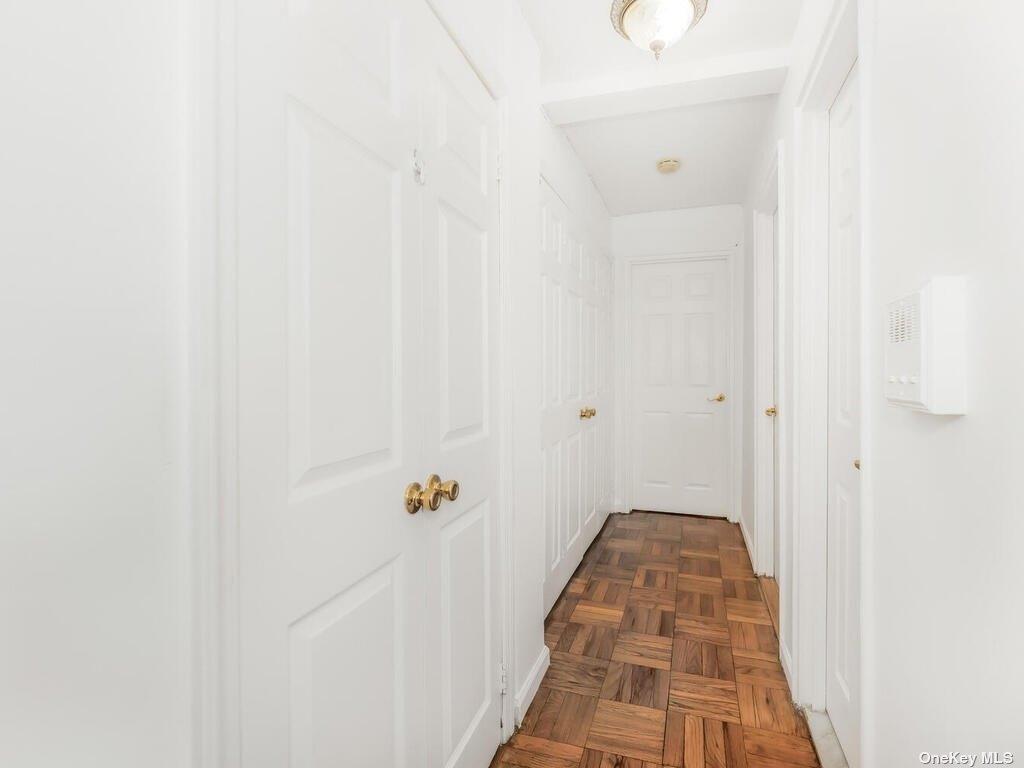 2835 Webb Avenue, Unit 7E Bronx, NY 10468 - Photo 16 of 24 a view of a hallway with wooden floor and staircase