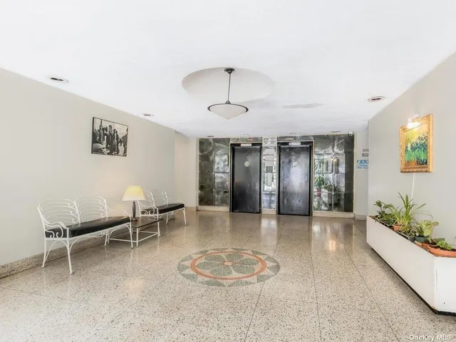 a view of a livingroom with furniture and a chandelier