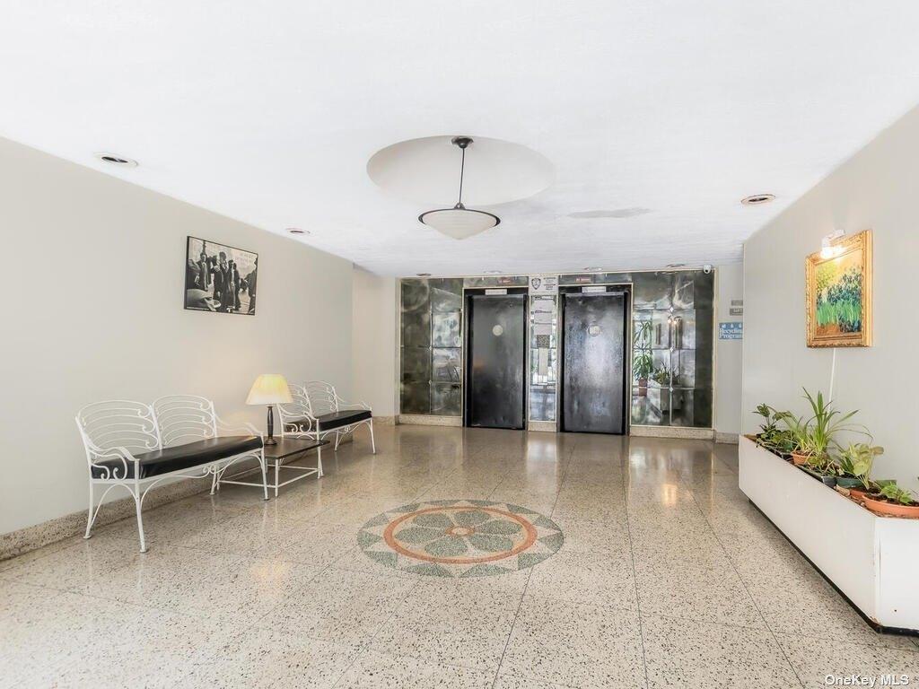2835 Webb Avenue, Unit 7E Bronx, NY 10468 - Photo 2 of 24 a view of a livingroom with furniture and a chandelier