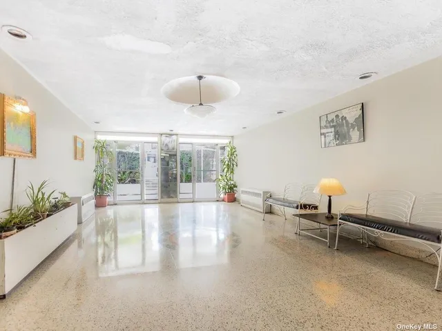 a view of a living room and a ceiling fan