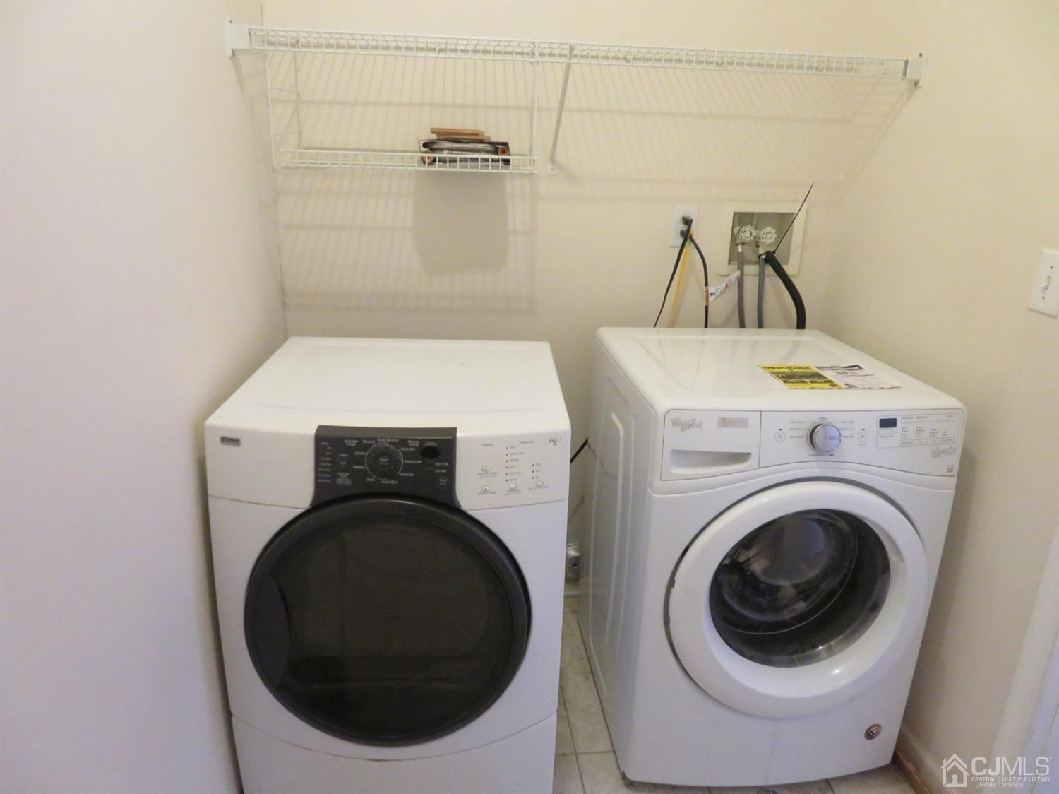 55 Devon Drive East Brunswick, NJ 08816 - Photo 11 of 28 a utility room with dryer and washer