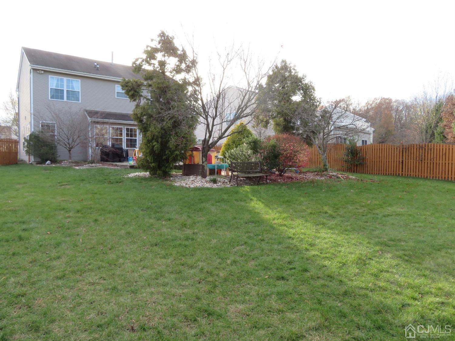 55 Devon Drive East Brunswick, NJ 08816 - Photo 22 of 28 a view of a house with a yard