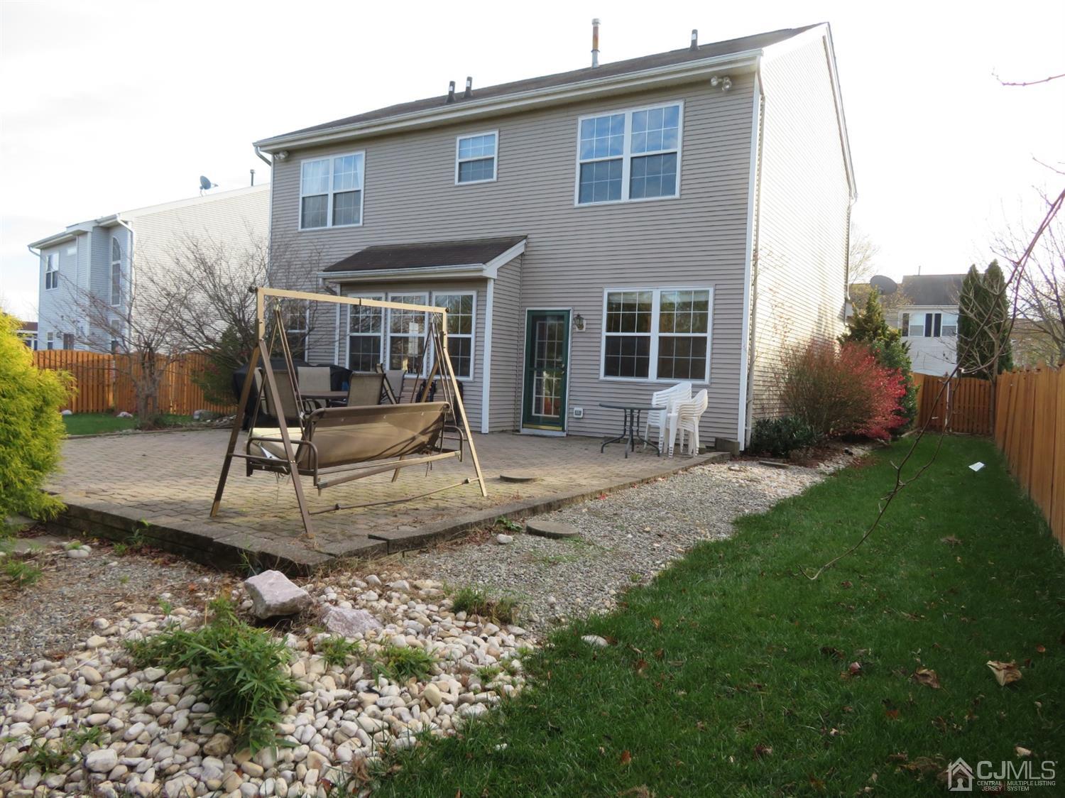 55 Devon Drive East Brunswick, NJ 08816 - Photo 24 of 28 a house view with a garden space