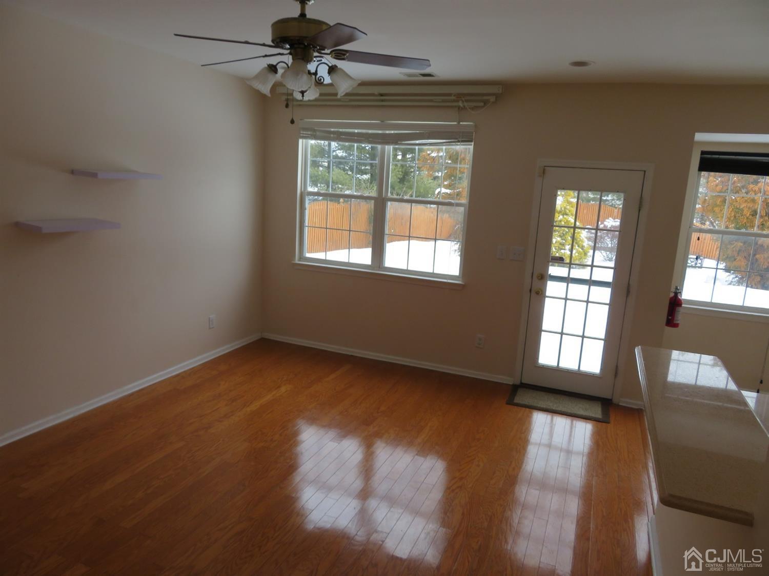 55 Devon Drive East Brunswick, NJ 08816 - Photo 7 of 28 a view of an empty room with a window