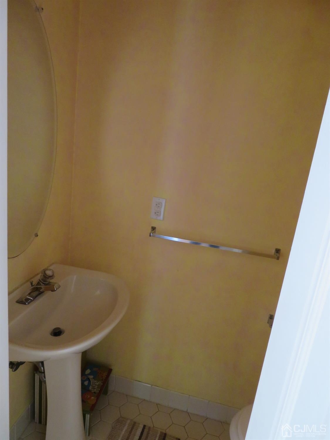 55 Devon Drive East Brunswick, NJ 08816 - Photo 10 of 28 a bathroom with a sink and mirror