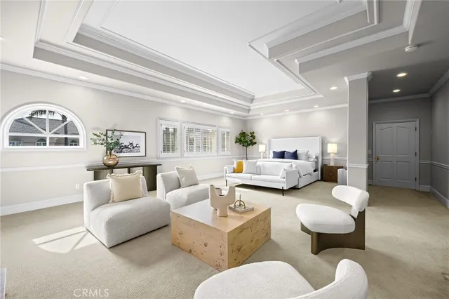a living room with furniture a rug and white walls