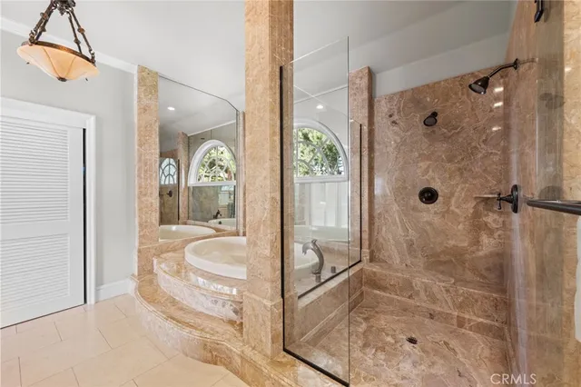 a spacious bedroom with a large bed and a window