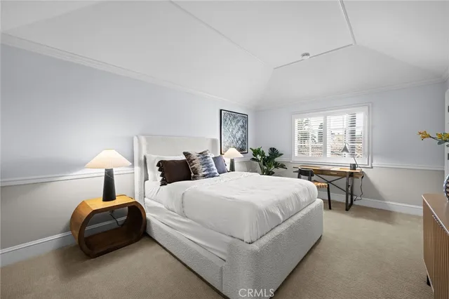 a kitchen with a window sink and cabinets