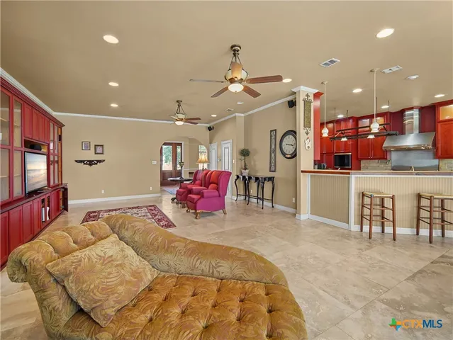 a kitchen with stainless steel appliances granite countertop a sink stove and cabinets