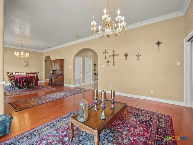 a spacious bathroom with a granite countertop sink toilet a mirror and shower
