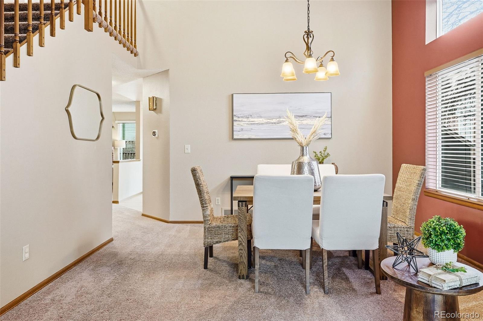 8362 Sunnyside Place Highlands Ranch, CO 80126 - Photo 12 of 50 a view of a dining room with furniture window and wooden floor