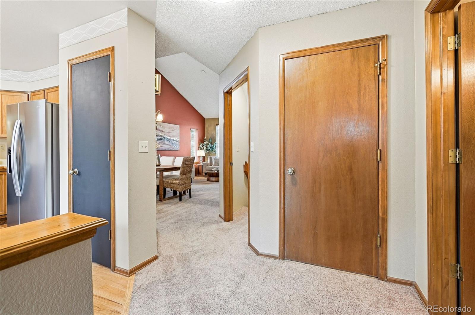 8362 Sunnyside Place Highlands Ranch, CO 80126 - Photo 13 of 50 a view of a hallway with dining area