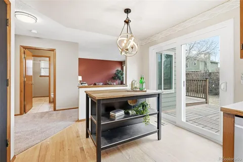 a view of living room with furniture and potted plant