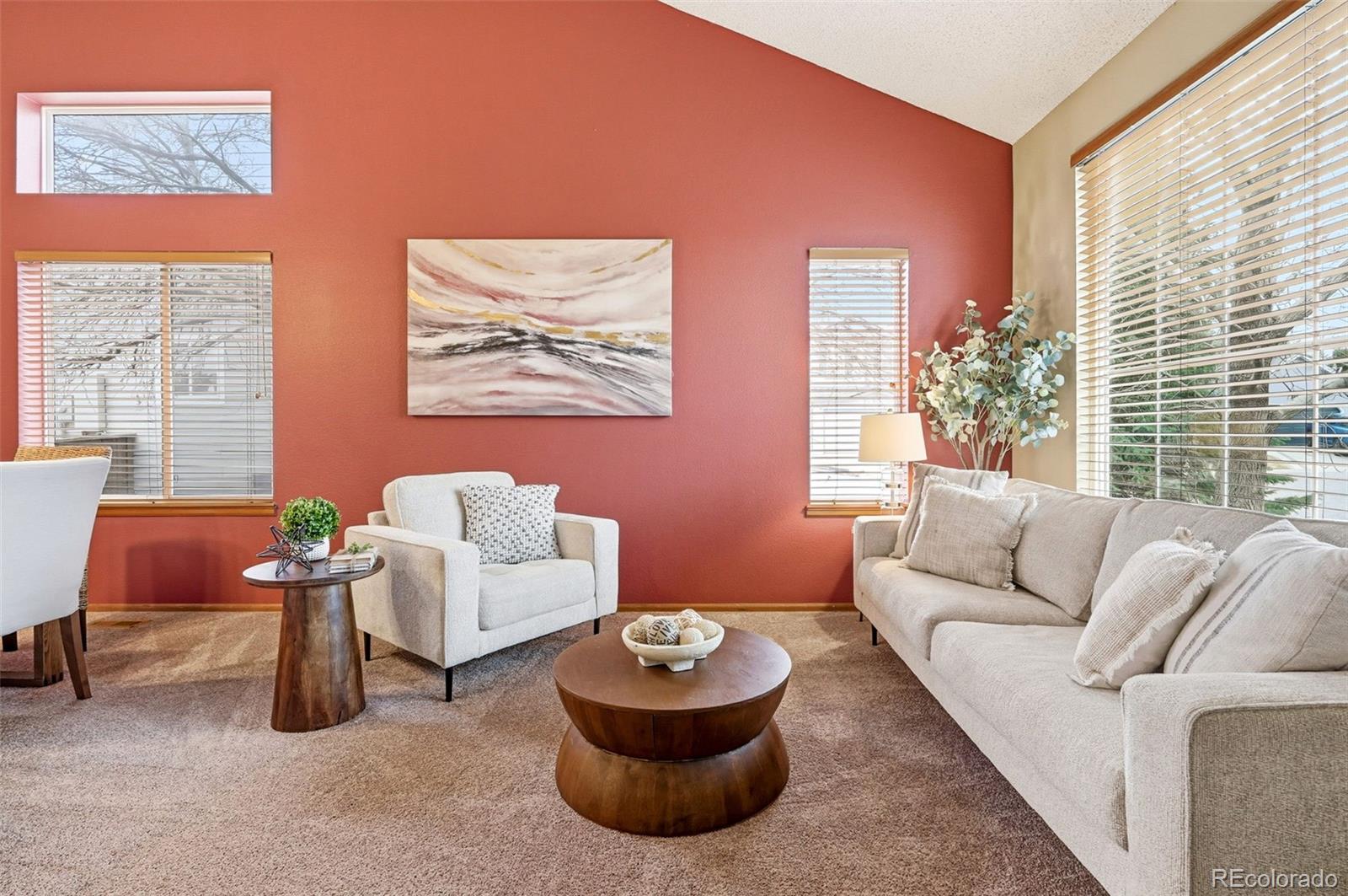 8362 Sunnyside Place Highlands Ranch, CO 80126 - Photo 2 of 50 a living room with furniture and a large window