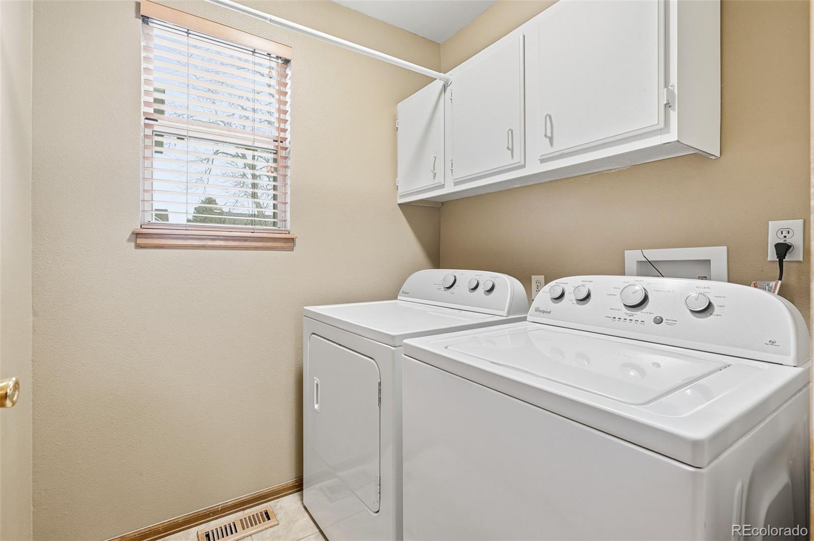 8362 Sunnyside Place Highlands Ranch, CO 80126 - Photo 23 of 50 a utility room with dryer and washer