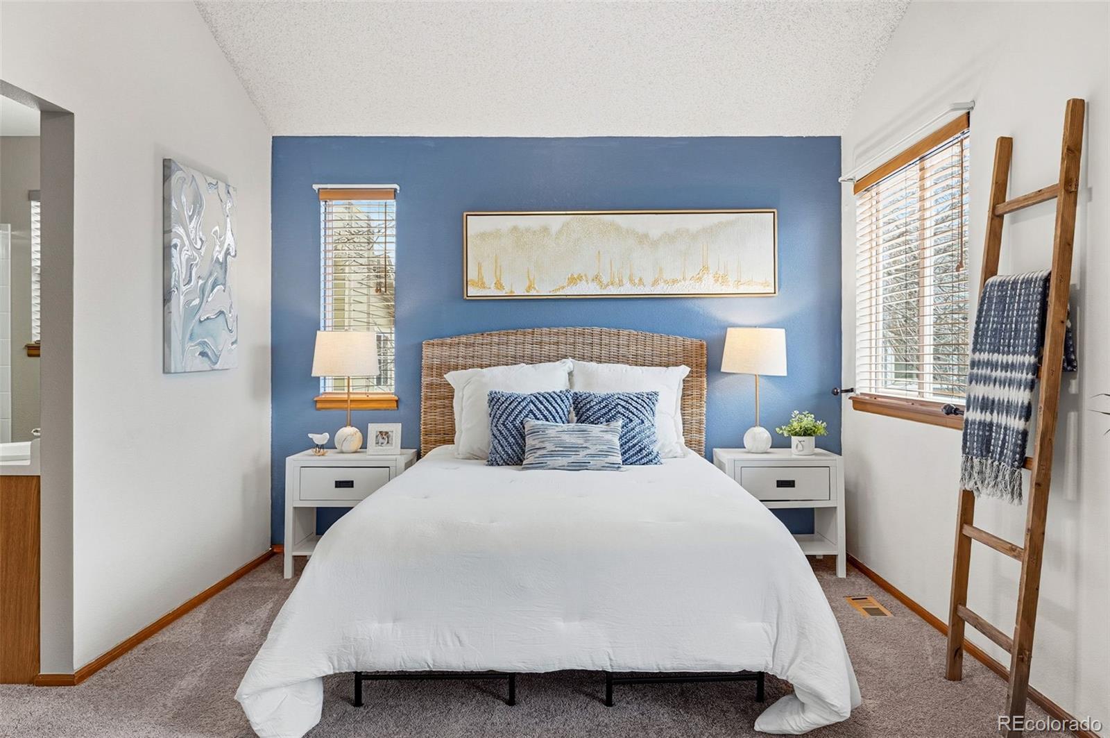 8362 Sunnyside Place Highlands Ranch, CO 80126 - Photo 25 of 50 a bedroom with a bed and wooden floor