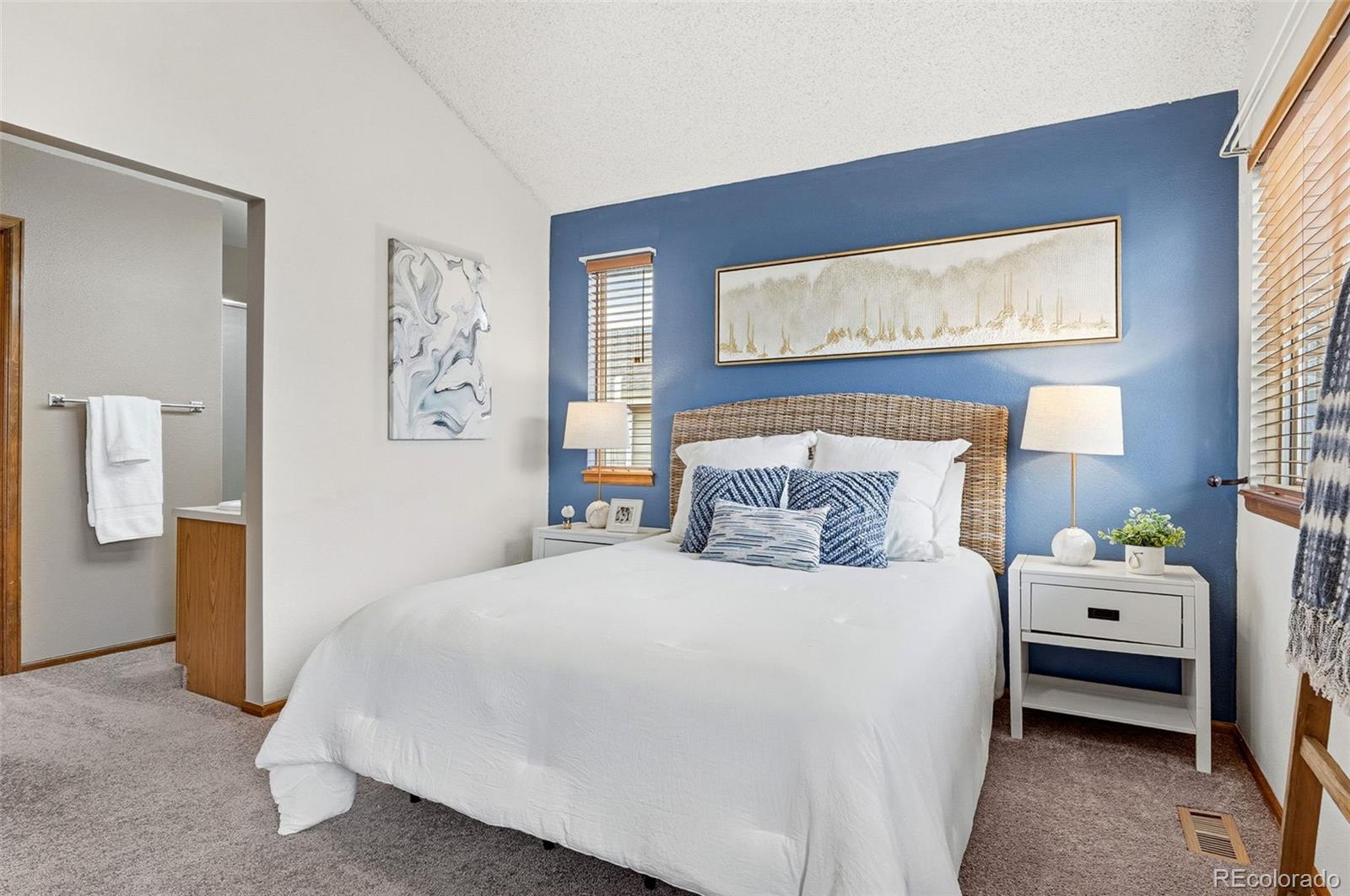 8362 Sunnyside Place Highlands Ranch, CO 80126 - Photo 26 of 50 a bedroom with a bed and a window