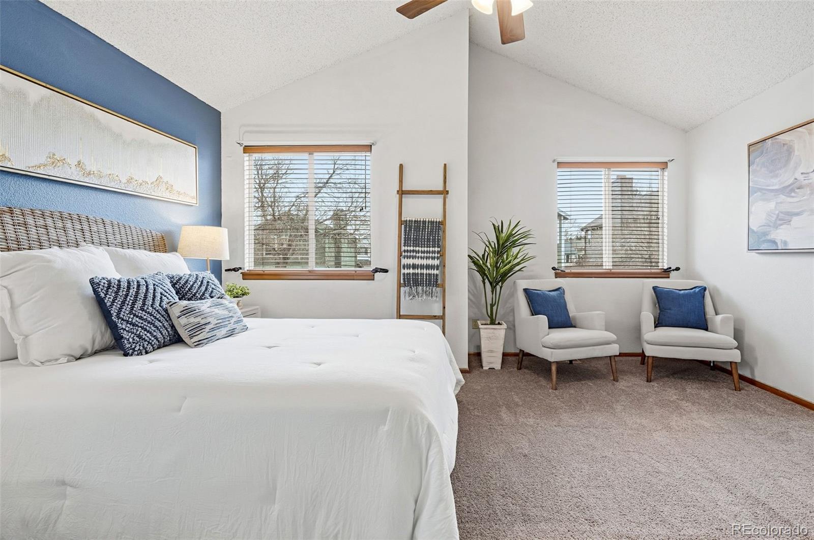 8362 Sunnyside Place Highlands Ranch, CO 80126 - Photo 27 of 50 a bedroom with bed and large windows