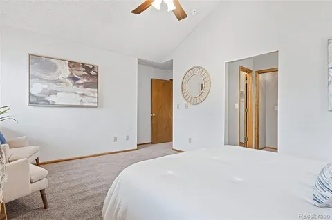 a bathroom with a sink vanity granite and a mirror