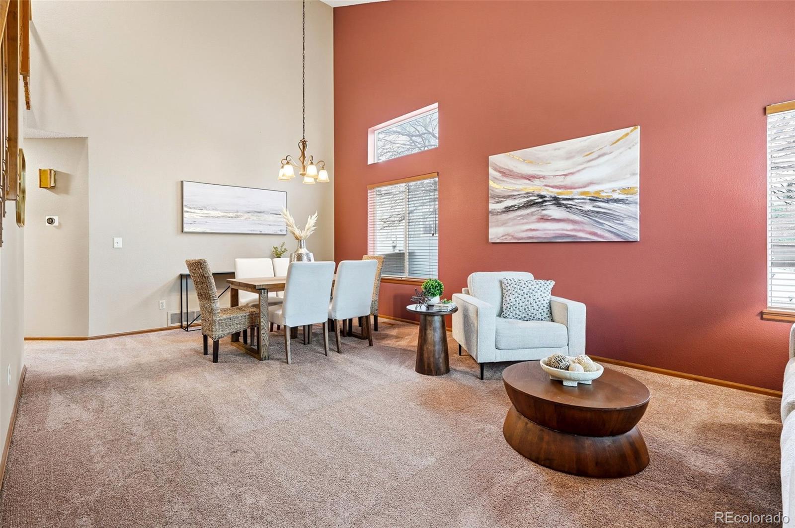 8362 Sunnyside Place Highlands Ranch, CO 80126 - Photo 3 of 50 a living room with furniture and a large window