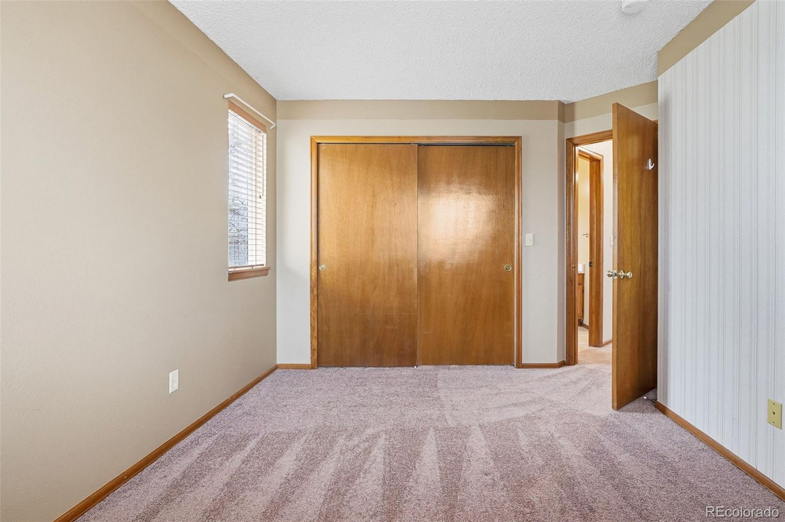 8362 Sunnyside Place Highlands Ranch, CO 80126 - Photo 34 of 50 a view of an empty room with a window