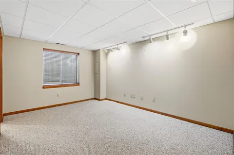 a bathroom with a sink a toilet and shower curtain