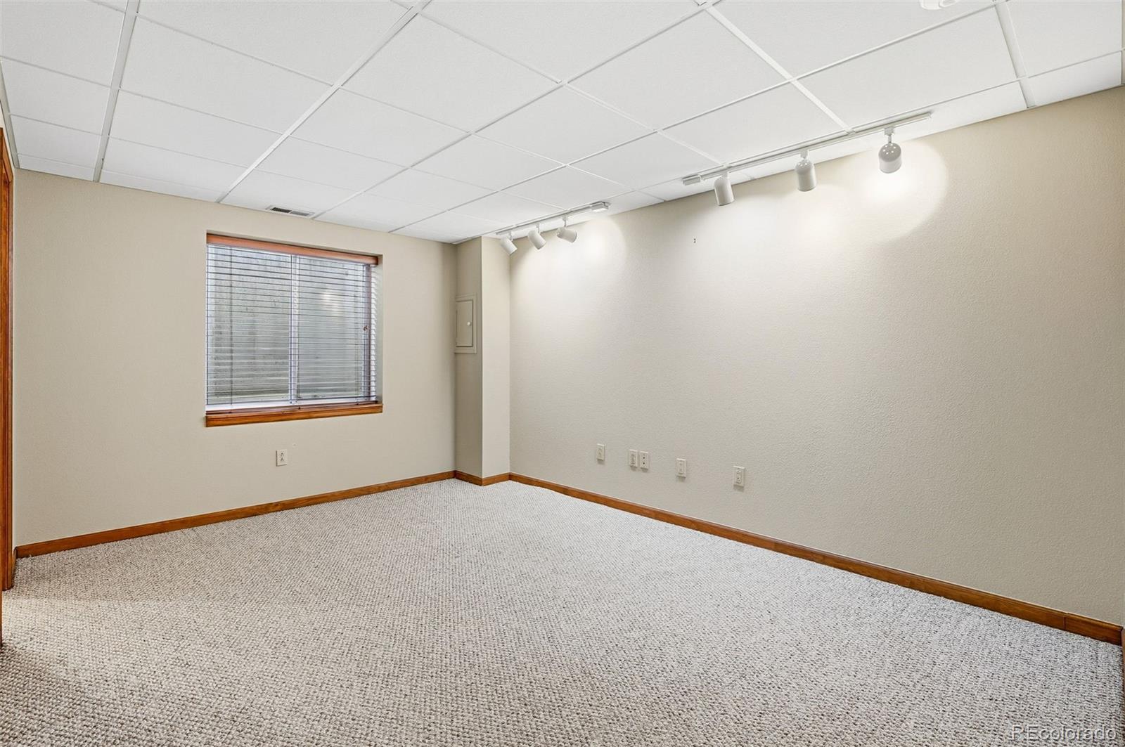 8362 Sunnyside Place Highlands Ranch, CO 80126 - Photo 43 of 50 a view of a room with an empty space and a window