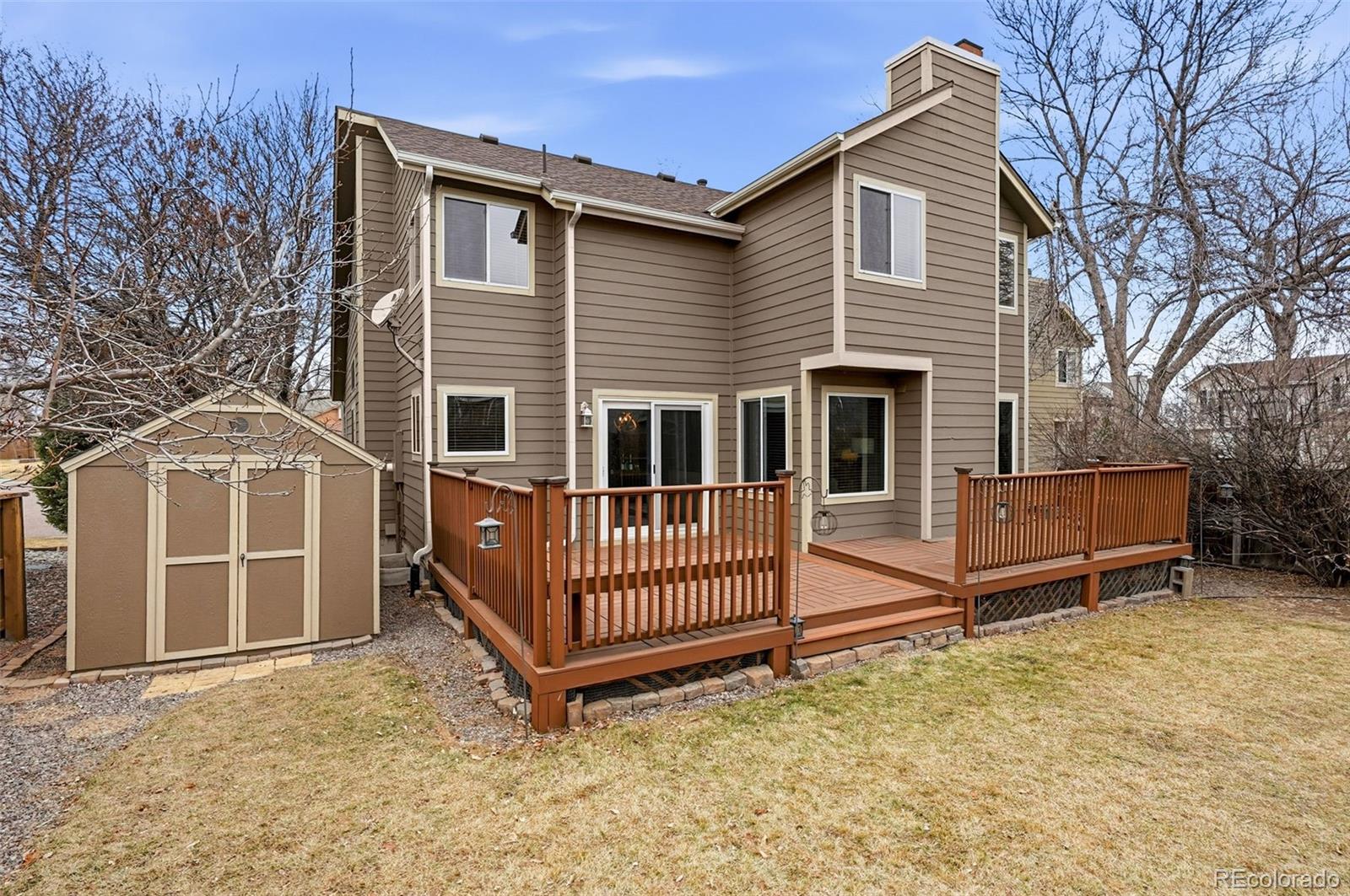 8362 Sunnyside Place Highlands Ranch, CO 80126 - Photo 48 of 50 front view of a house with a yard