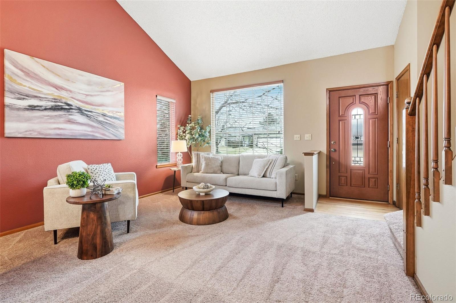 8362 Sunnyside Place Highlands Ranch, CO 80126 - Photo 10 of 50 a living room with furniture and a potted plant