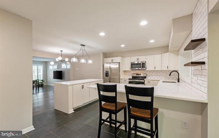 2317 37th Street Northwest Washington, DC 20007 - Photo 26 of 54 Modern kitchen with sleek finishes.