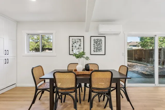 a view of a dining room with furniture window and outside view