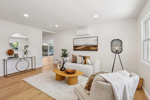 a bedroom with furniture and a window