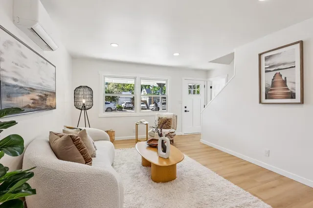 a living room with furniture and window