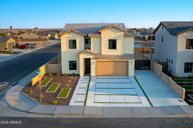 a front view of a house with a yard