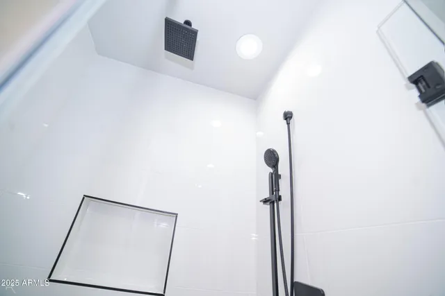 a bathroom with a double vanity sink and mirror